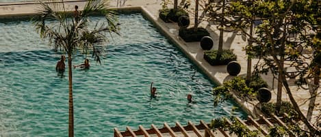 Indoor pool, pool umbrellas, pool loungers