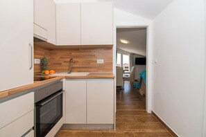 Apartment (A3) | Private kitchen | Fridge, stovetop, dishwasher, espresso maker - Apartments Baldo (Vodice)