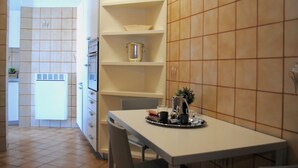 Apartment, 3 Bedrooms | Private kitchen | Full-size fridge, oven, stovetop, dishwasher