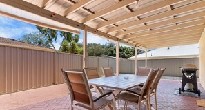 Enjoy al fresco dining on the patio with a barbecue grill and comfortable seating for six.