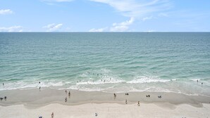 A beach with clear skies and calm waters. - 1004 Waters Edge Resort 1 Bedroom Condo by RedAwning (Murrells Inlet)