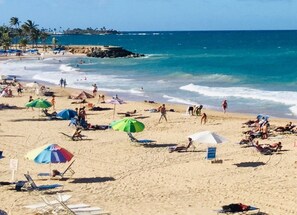 On the beach, sun loungers, beach towels