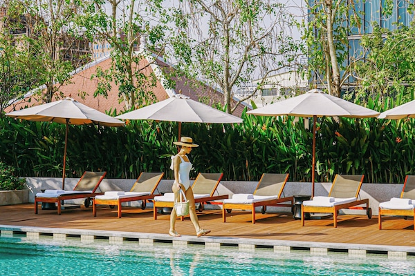 Outdoor pool, open 6:30 AM to 6:30 PM, free cabanas, pool umbrellas