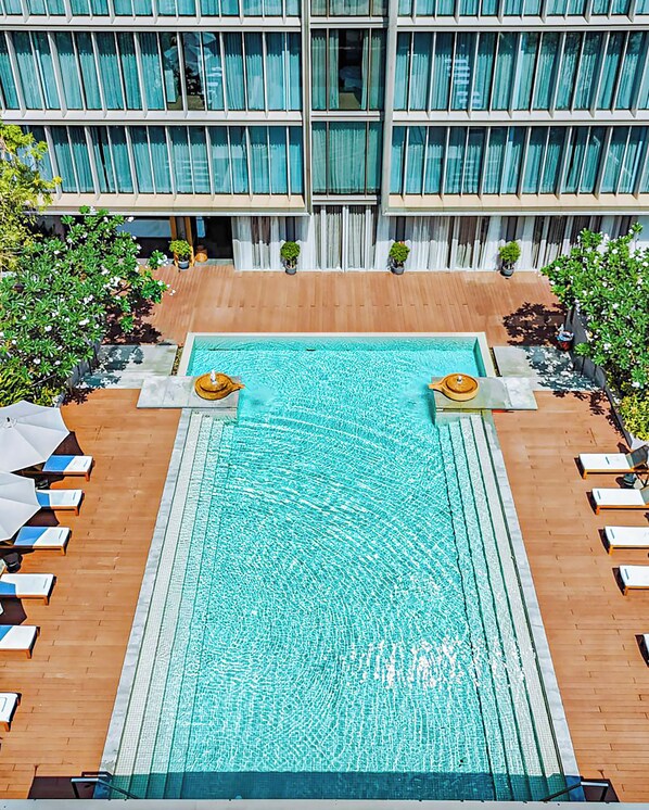 Outdoor pool, open 6:30 AM to 6:30 PM, free cabanas, pool umbrellas