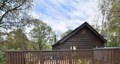 Authentic log cabin close to loch shore, with hot tub & wood burning stove.