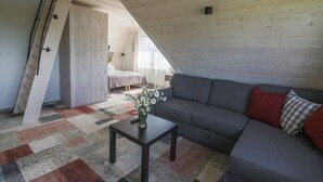 Departamento Deluxe (8) | Sala de estar | Televisión de pantalla plana