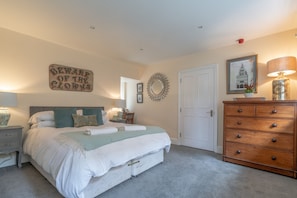 1 bedroom, desk, iron/ironing board, travel crib