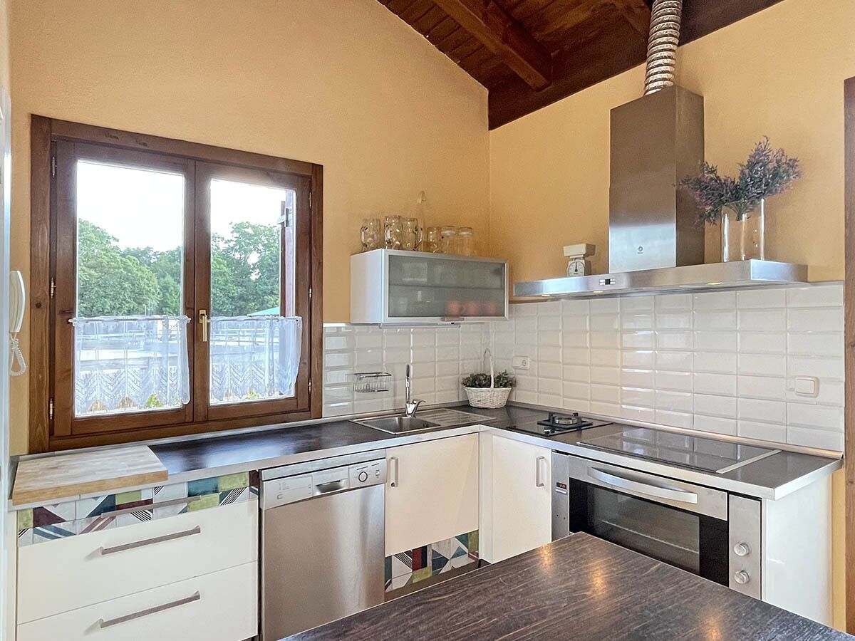 Casa Orgi, surrounded by meadows and horses.