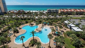 A resort with a large central pool, multiple buildings, and a beach view. - Sea Breeze, Destin Studio, Pools, Beach (Destin)