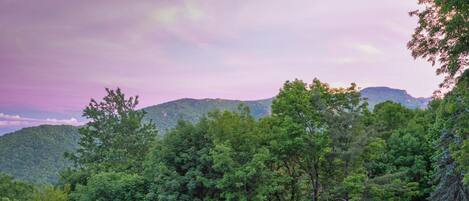 Evenings like this are why you came. Sweeping Blue Ridge views paint the sky in pink from the deck at A Big View.