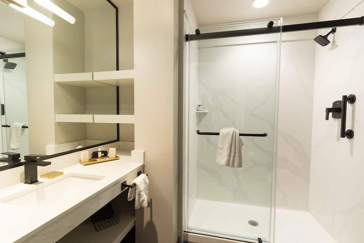 Combined shower/tub, designer toiletries, hair dryer, bathrobes