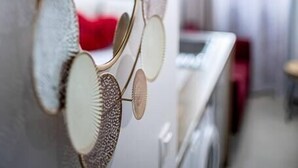 A wall-mounted mirror with a circular frame. - Beautiful Break in Paris Gentilly (Gentilly)