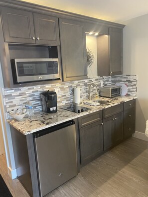 Enjoy cooking in this well-equipped kitchen with a dishwasher, microwave, coffee maker, and toaster.