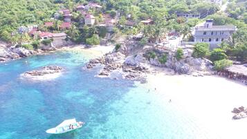 On the beach, sun loungers