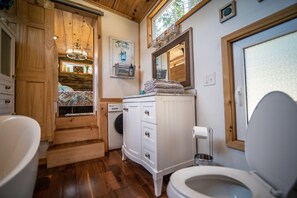 Bathtub, hair dryer, towels, soap