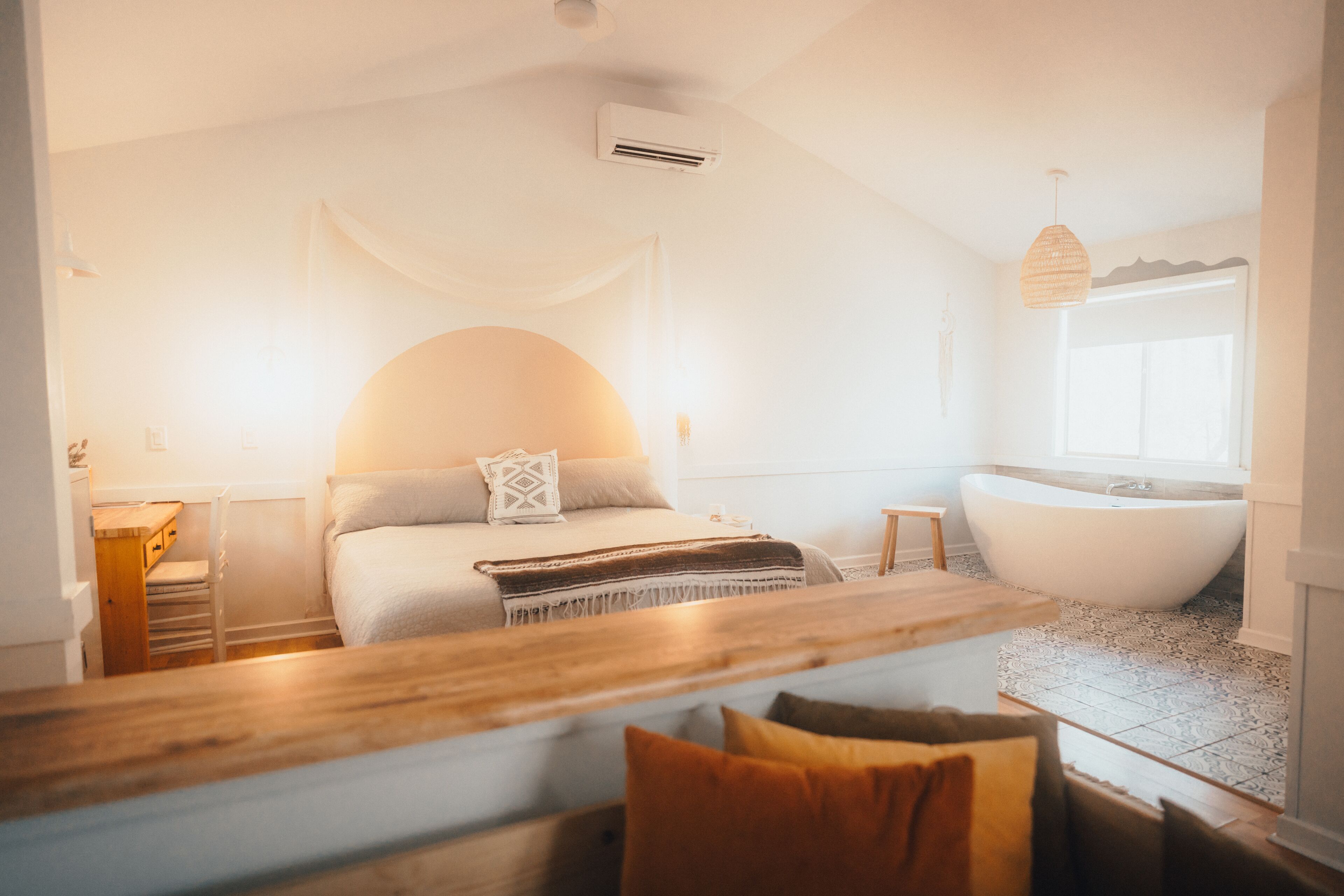 Comfy king sized bed next to an amazing 75’’ modern bathtub