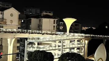 A multi-level building with balconies and a bridge-like structure connecting the levels.
