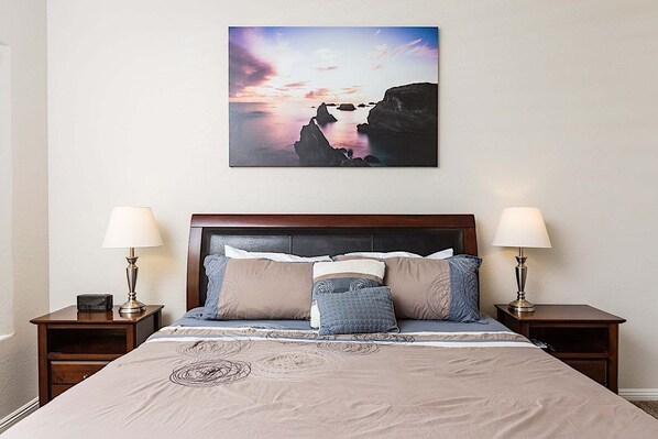A bedroom with a bed, two bedside tables, and a wall-mounted picture. - Westgate Wonder ~ A Resort-Style Oasis w/ Heated Pool, Spa, Game Rooms, Putting Green & More! (Glendale)