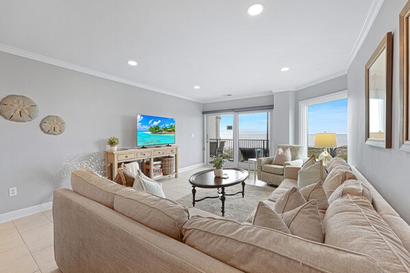 Bright and airy living area featuring coastal furnishings and sliding doors that open to your private oceanfront balcony. - Oceanfront Hilton Head Villa with Pool, Private Deck, King Suite, Beach Access & Stunning Views (Hilton Head Island)