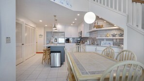 Enjoy meals in this well-equipped kitchen and dining area with a large table and comfortable seating for four.