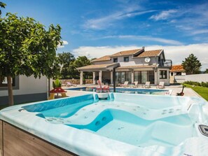 A modern house with a swimming pool and a hot tub. - Oasis of peace by Interhome (Imotski)