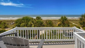 A balcony with a view of the beach and ocean. - Luxury Family Oceanfront Oasis | Private Pool, Sun Decks w Views, Walkable to Coligny Plaza (Hilton Head Island)