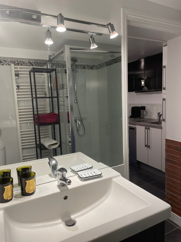 Bathtub, hair dryer, towels, soap