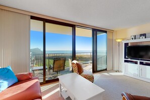 Enjoy ocean views from the balcony, relax in the seating area with a sofa and flat-screen TV.