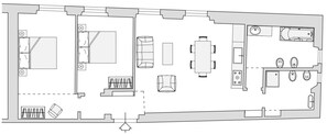 Plano de planta de un hotel que muestra un comedor, cocina y baño.