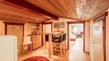 Economy Quadruple Room | Living area | 80-cm flat-screen TV with satellite channels, TV