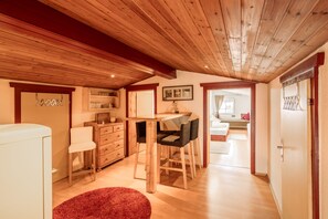 Economy Quadruple Room | Living area | 80-cm flat-screen TV with satellite channels, TV - Hotel Fortuna (Ischgl)