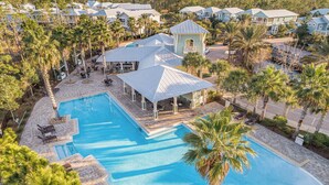 A resort with a large swimming pool, multiple guest villas, and a covered pavilion. - "Emerald Bliss" Luxury in NatureWalk 30A | Golf Cart + Bikes + Screened Porch (Santa Rosa Beach)