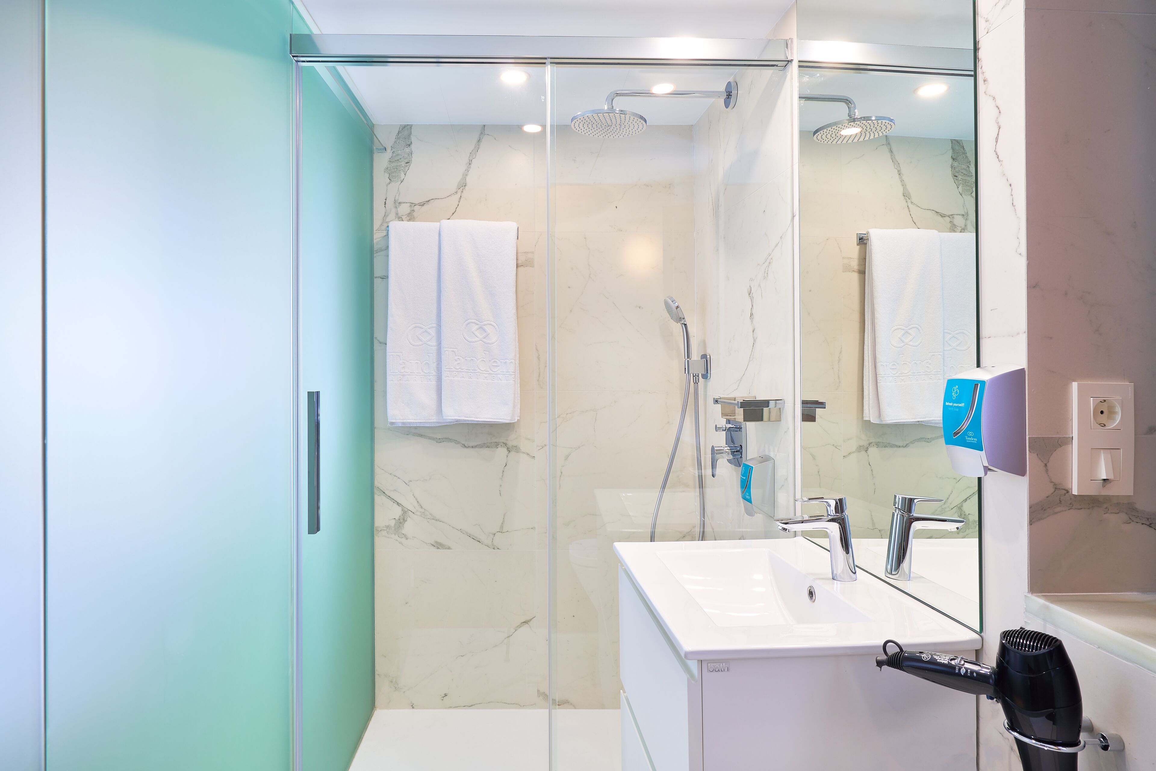 Shower, rainfall showerhead, eco-friendly toiletries, hair dryer