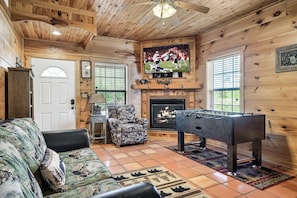 Smart TV, fireplace, table football, books