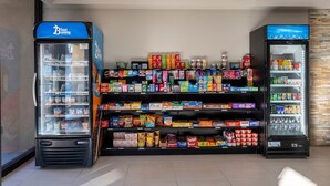 A vending machine area with a Blue Bunny ice cream dispenser and a beverage dispenser. - HomeTowne Studios by Red Roof Bordentown - McGuire AFB (Bordentown)