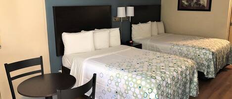 Desk, laptop workspace, blackout drapes, iron/ironing board