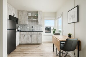 Fridge, microwave, stovetop, coffee/tea maker