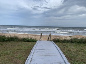On the beach, sun loungers, beach towels
