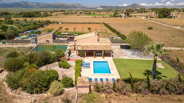 A villa with a swimming pool, surrounded by a well-maintained garden and a view of the countryside. - Can Butxet by Interhome (Can Picafort)