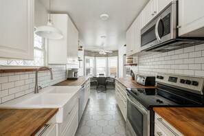 Fridge, microwave, stovetop, coffee/tea maker