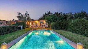 A swimming pool with a house in the background. - VILLA TARONGERS - STAY FOR COUPLES (Pollensa)
