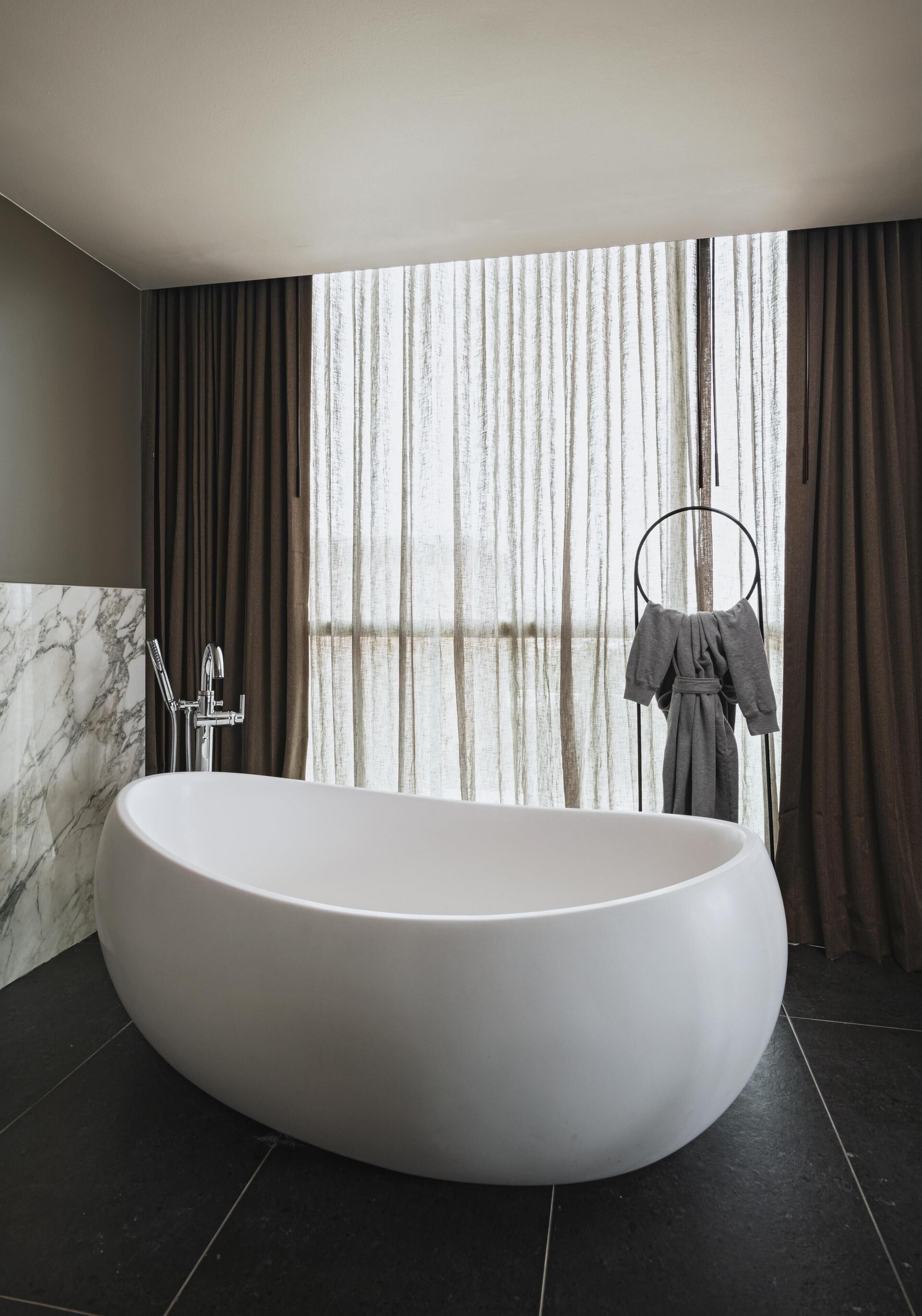 designer toiletries, hair dryer, bathrobes, towels