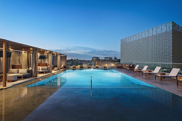 Outdoor pool, open 7:00 AM to 10:00 PM, cabanas (surcharge)