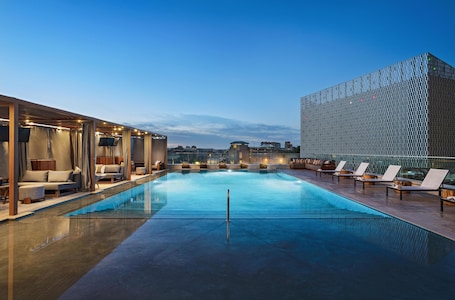 Outdoor pool, open 7:00 AM to 10:00 PM, cabanas (surcharge)