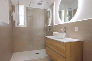Combined shower/tub, hair dryer, towels, toilet paper