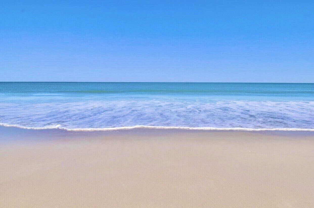 On the beach, sun loungers, beach towels