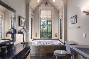 Bathtub, hair dryer, towels, soap