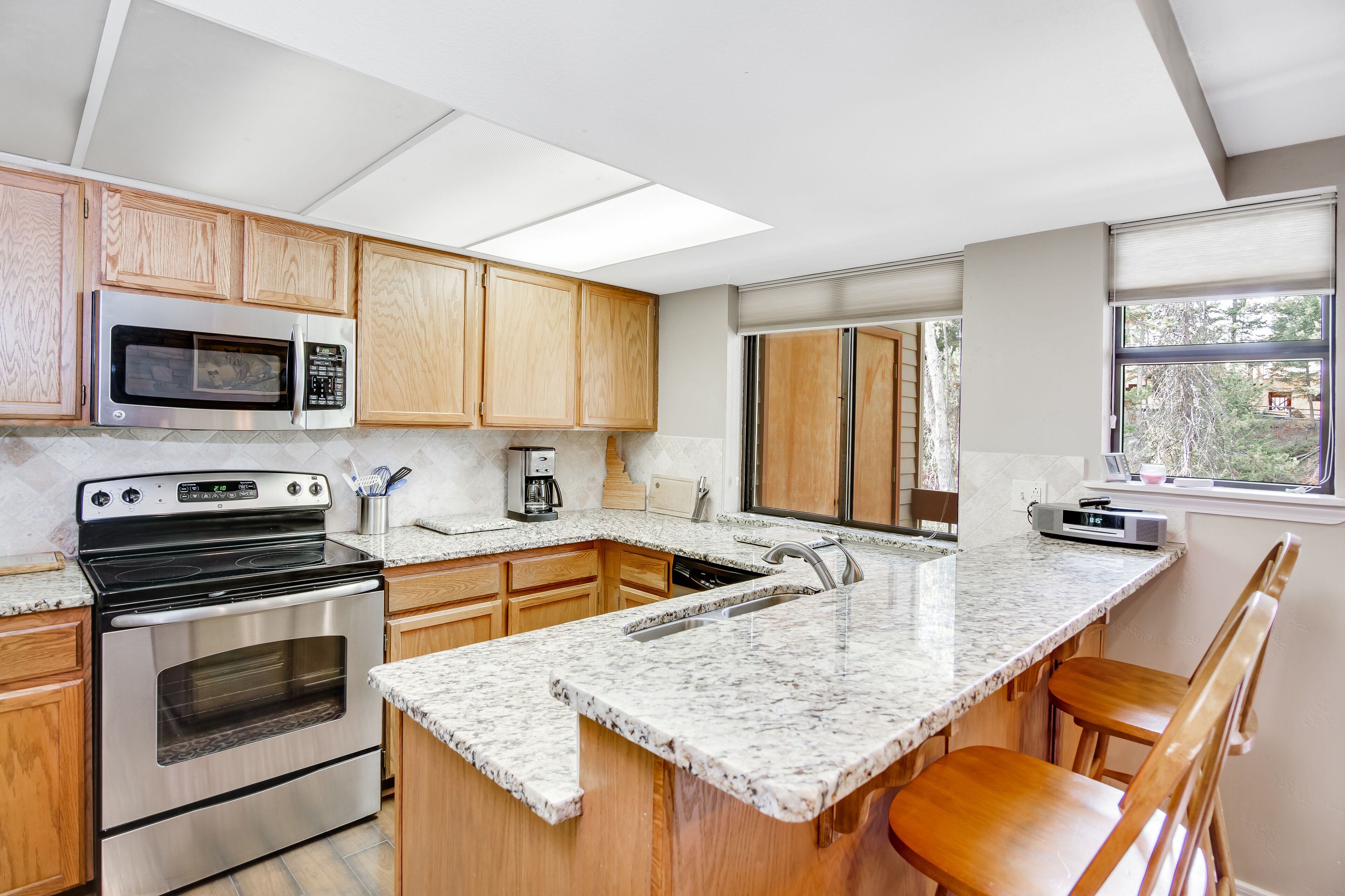 Riverfront retreat w/ private balcony, shared pool, tennis courts, & free WiFi!