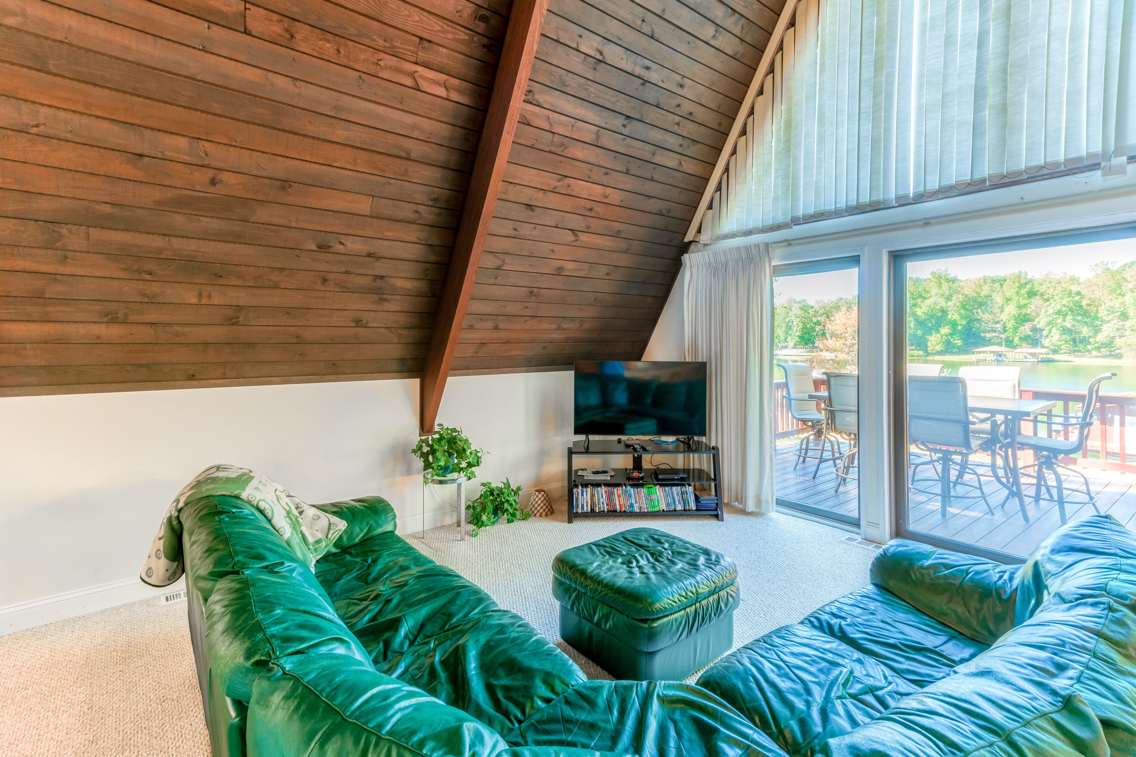 Charming, lakefront A-frame with private dock, lakeside gazebo, & balcony