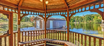Charming, lakefront A-frame with private dock, lakeside gazebo, spacious deck